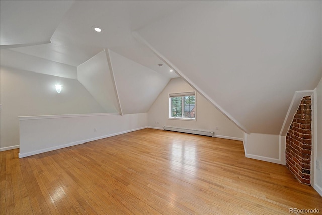 371 Birch St, Denver, CO 80220 - bonus room with a baseboard radiator, lofted ceiling, light wood finished floors, and baseboards