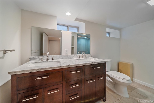 371 Birch St, Denver, CO 80220 - full bathroom with tile patterned floors, a sink, double vanity, and toilet