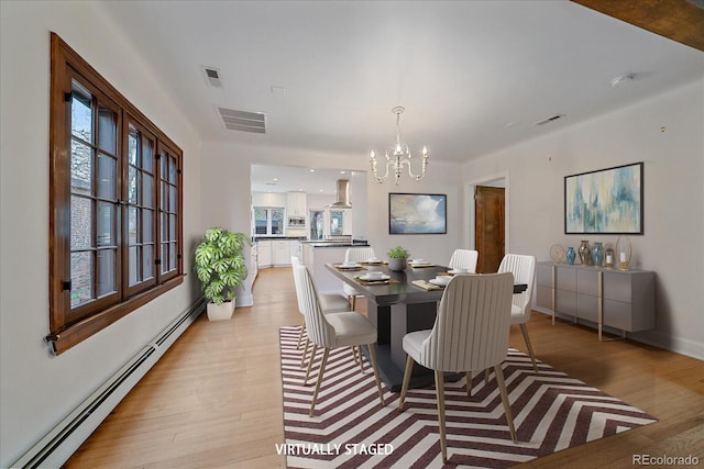 371 Birch St, Denver, CO 80220 - dining room featuring a baseboard heating unit, light wood-style flooring, visible vents, and a chandelier