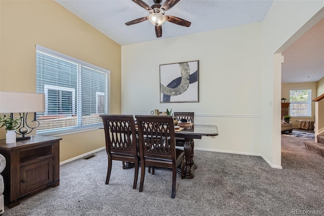 dining area featuring ceiling fan and carpet flooring