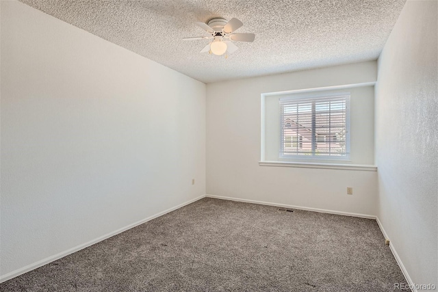 spare room featuring ceiling fan, a textured ceiling, and carpet flooring