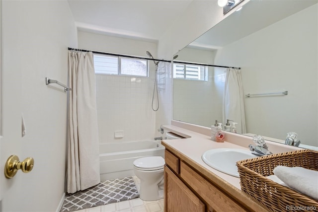 full bathroom with toilet, vanity, and shower / bath combo