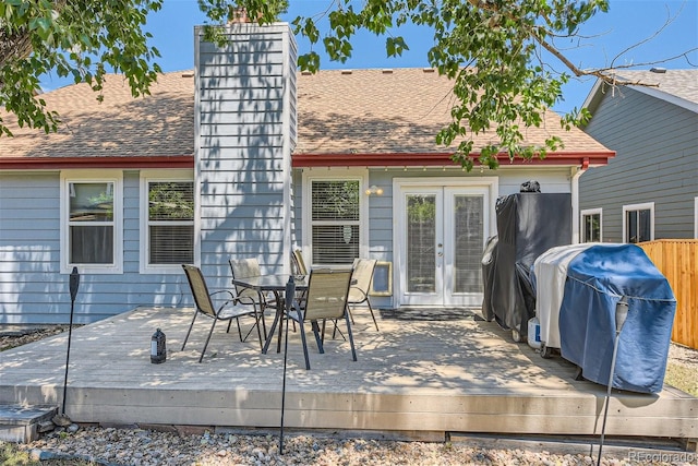 wooden terrace with grilling area and french doors