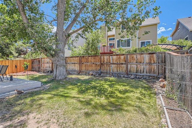 view of yard featuring a wooden deck