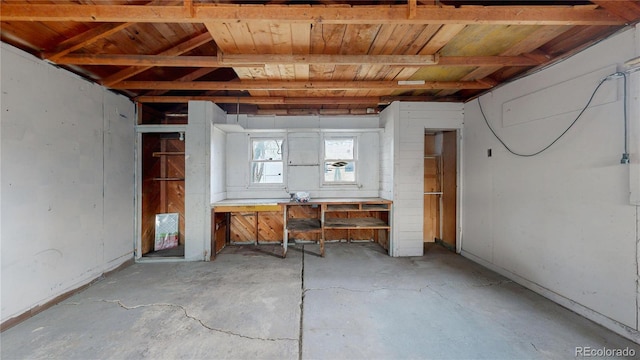 interior space featuring wooden ceiling and a workshop area