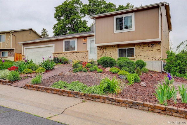 10527 Pierson Cir, Westminster, CO 80021 - tri-level home featuring brick siding and a garage