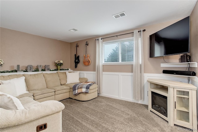 10527 Pierson Cir, Westminster, CO 80021 - carpeted living room featuring a wainscoted wall and a decorative wall