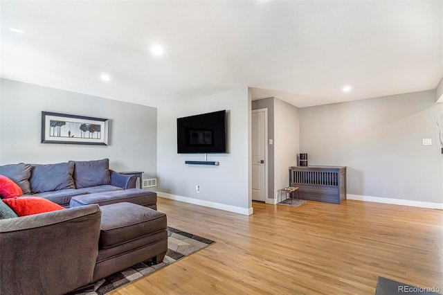 9580 W 51st Ave, Arvada, CO 80002 - living area featuring light wood-style flooring and recessed lighting