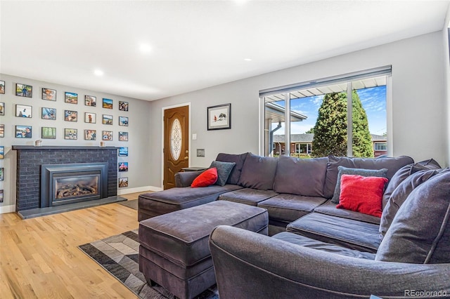 9580 W 51st Ave, Arvada, CO 80002 - living room with light wood-style floors, recessed lighting, and a fireplace