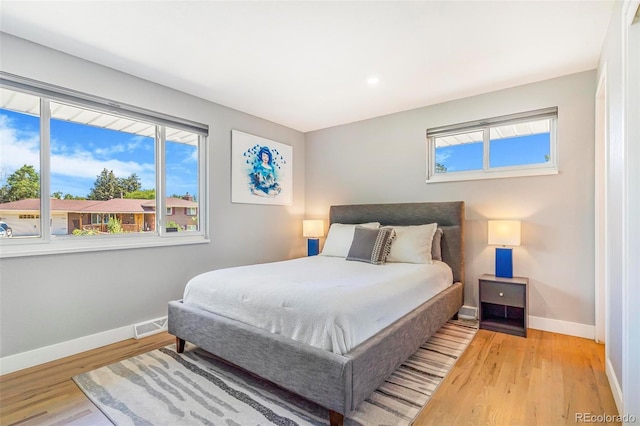 9580 W 51st Ave, Arvada, CO 80002 - bedroom featuring baseboards and light wood finished floors