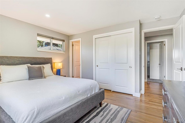 9580 W 51st Ave, Arvada, CO 80002 - bedroom featuring light wood-style floors, a closet, and recessed lighting