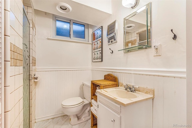 9580 W 51st Ave, Arvada, CO 80002 - bathroom featuring a wainscoted wall, marble finish flooring, and vanity