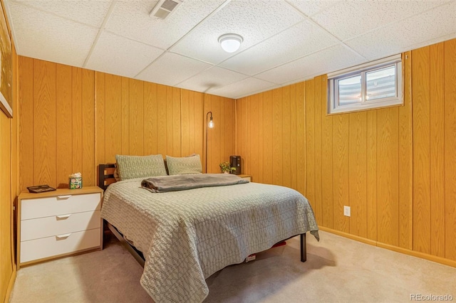 9580 W 51st Ave, Arvada, CO 80002 - bedroom featuring light carpet, a drop ceiling, and wood walls