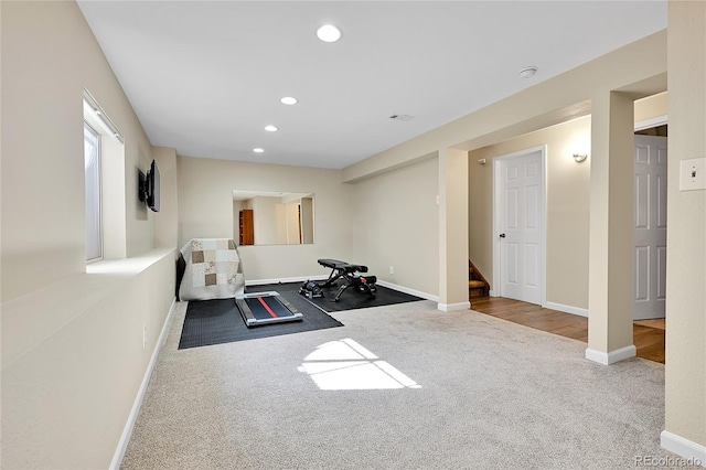 exercise room featuring carpet flooring, recessed lighting, and baseboards