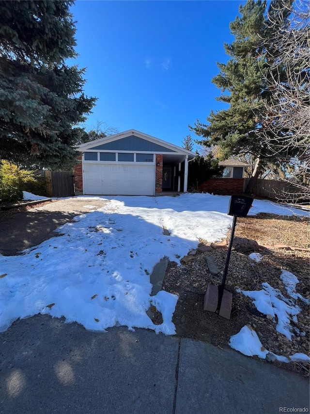 view of front facade with a garage and a carport