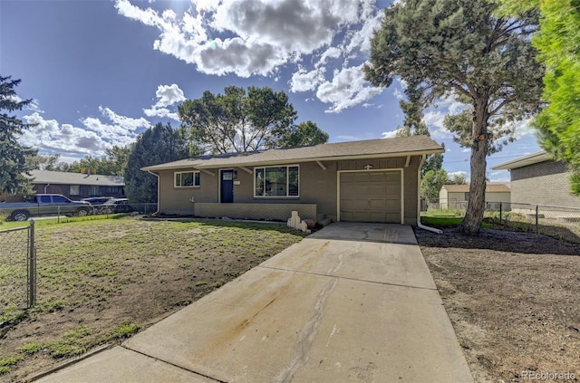 ranch-style house with a garage and a front yard