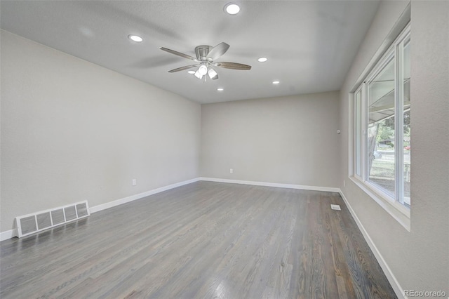 unfurnished room featuring hardwood / wood-style flooring and ceiling fan