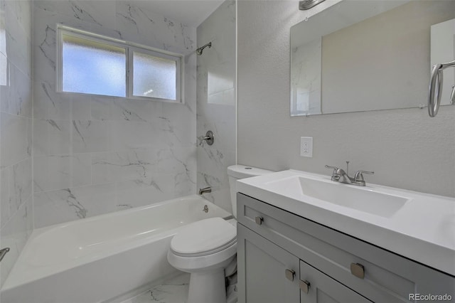 full bathroom with tiled shower / bath, vanity, and toilet