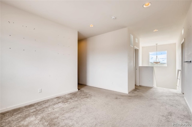 unfurnished room featuring carpet flooring