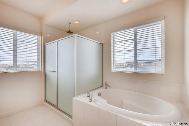 bathroom featuring tile patterned flooring and plus walk in shower