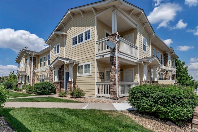 9387 Ashbury Cir Unit 203, Parker, CO 80134 - townhome / multi-family property with a balcony and covered porch