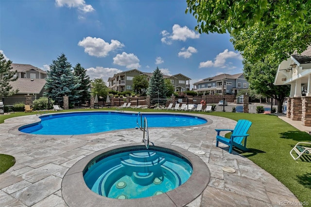 9387 Ashbury Cir Unit 203, Parker, CO 80134 - community pool with a residential view, a hot tub, and a patio