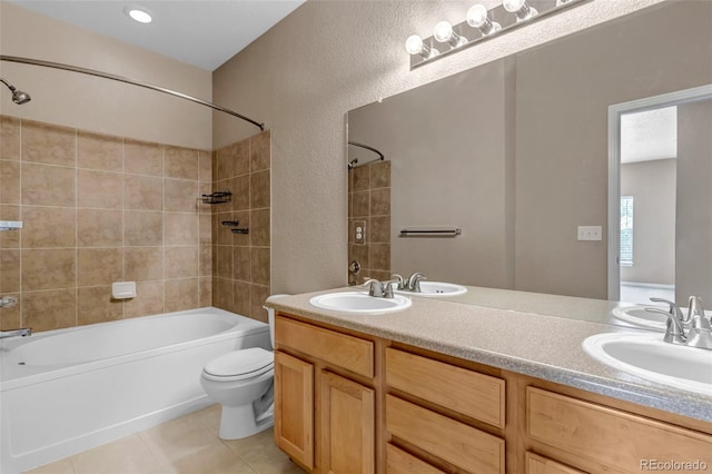 9387 Ashbury Cir Unit 203, Parker, CO 80134 - bathroom with shower / washtub combination, tile patterned floors, double vanity, and a textured wall