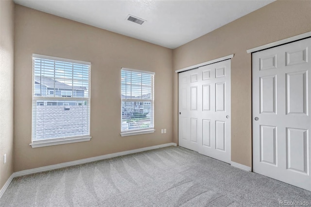 9387 Ashbury Cir Unit 203, Parker, CO 80134 - unfurnished bedroom featuring light colored carpet