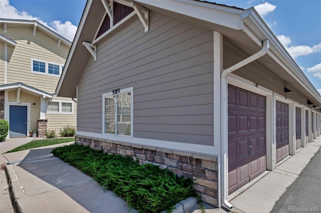 9387 Ashbury Cir Unit 203, Parker, CO 80134 - view of home's exterior with a garage