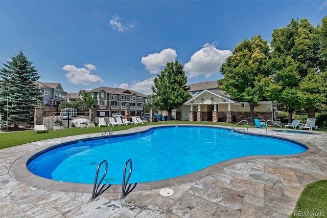 9387 Ashbury Cir Unit 203, Parker, CO 80134 - community pool with a patio and a residential view