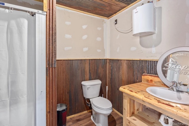 110 Evans Ave, Poncha Springs, CO 81242 - bathroom with wainscoting, wooden walls, wood finished floors, and a shower with curtain