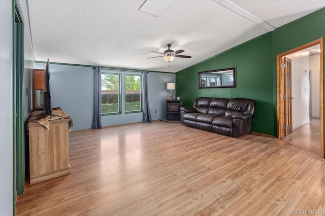 110 Evans Ave, Poncha Springs, CO 81242 - living area with vaulted ceiling, a textured ceiling, ceiling fan, and light wood-style floors