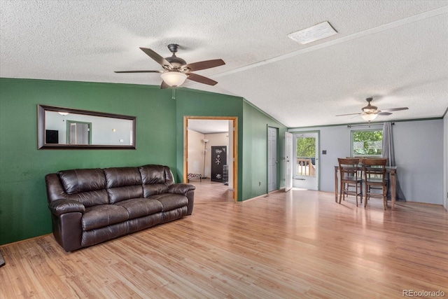110 Evans Ave, Poncha Springs, CO 81242 - living room featuring ceiling fan, wood finished floors, lofted ceiling, and a textured ceiling
