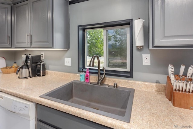 110 Evans Ave, Poncha Springs, CO 81242 - kitchen with gray cabinets, dishwasher, and light countertops