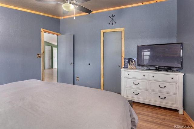 110 Evans Ave, Poncha Springs, CO 81242 - bedroom featuring wood finished floors and a ceiling fan