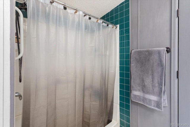 110 Evans Ave, Poncha Springs, CO 81242 - full bath featuring tile walls, a shower with shower curtain, and a textured ceiling