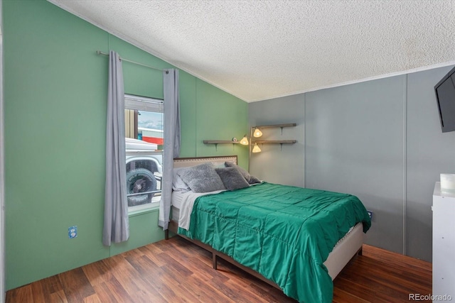 110 Evans Ave, Poncha Springs, CO 81242 - bedroom with a textured ceiling, wood finished floors, lofted ceiling, and ornamental molding