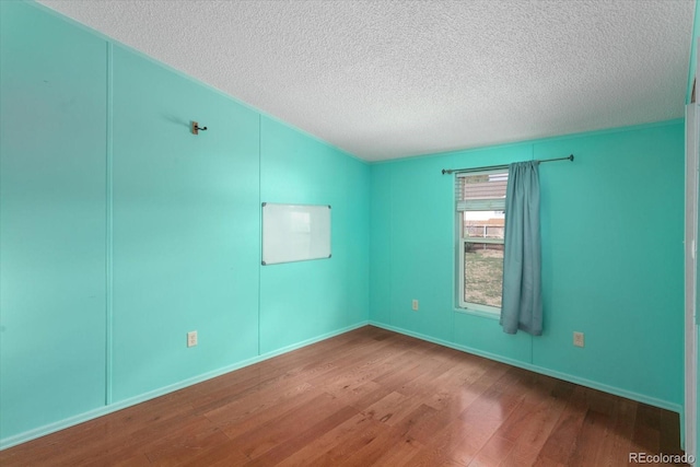 110 Evans Ave, Poncha Springs, CO 81242 - unfurnished room with wood finished floors and a textured ceiling