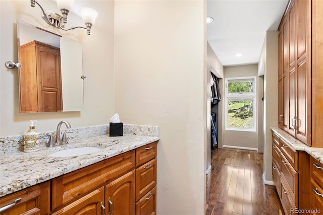 1555 Genesee Ridge Rd, Golden, CO 80401 - bathroom featuring hardwood / wood-style flooring, vanity, and recessed lighting