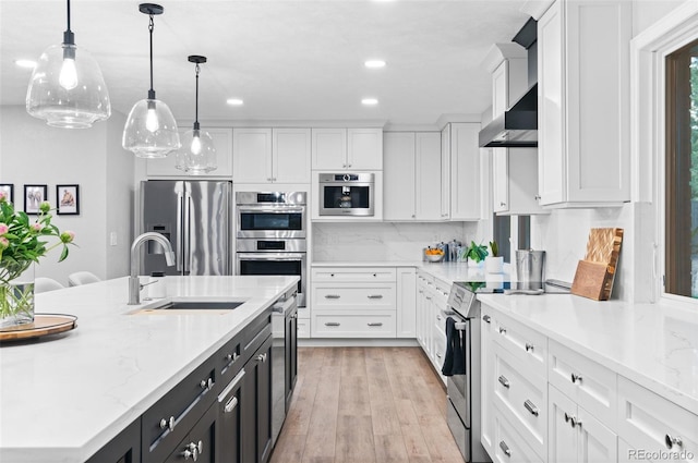 9939 E Aberdeen Ave, Englewood, CO 80111 - kitchen featuring appliances with stainless steel finishes, white cabinets, a sink, dark cabinetry, and recessed lighting