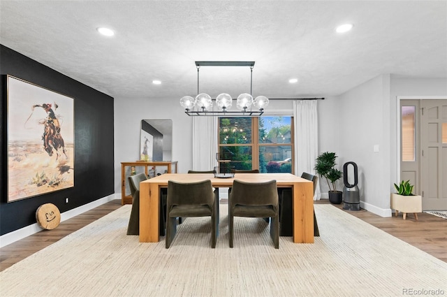 9939 E Aberdeen Ave, Englewood, CO 80111 - dining area with recessed lighting, a chandelier, baseboards, and light wood-type flooring
