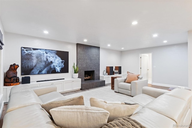9939 E Aberdeen Ave, Englewood, CO 80111 - living room featuring recessed lighting, a premium fireplace, and light wood-style flooring