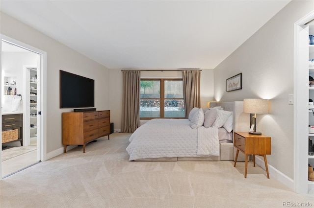 9939 E Aberdeen Ave, Englewood, CO 80111 - carpeted bedroom with baseboards, a walk in closet, and a closet
