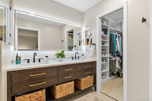 9939 E Aberdeen Ave, Englewood, CO 80111 - full bathroom featuring double vanity, tile patterned flooring, and a walk in closet