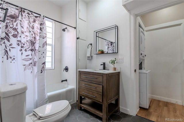 bathroom with shower / bath combo, plenty of natural light, vanity, and toilet