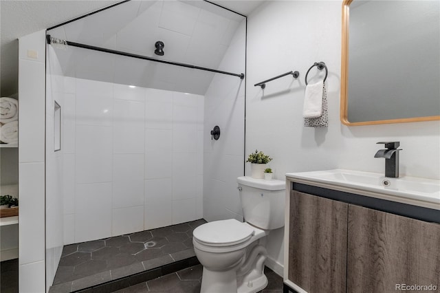 full bathroom with toilet, a stall shower, tile patterned flooring, and vanity