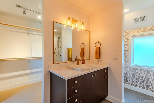 bathroom with vanity and tile patterned floors