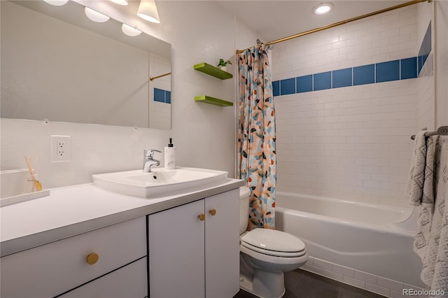 full bathroom featuring tile patterned flooring, vanity, toilet, and shower / tub combo