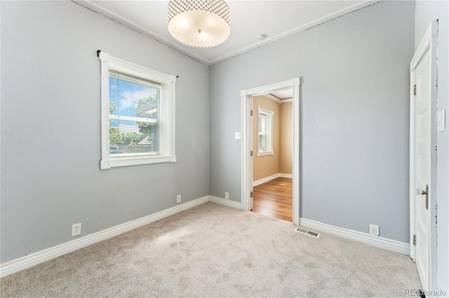 unfurnished bedroom with light carpet