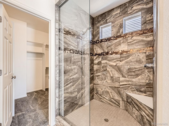 bathroom with tiled shower